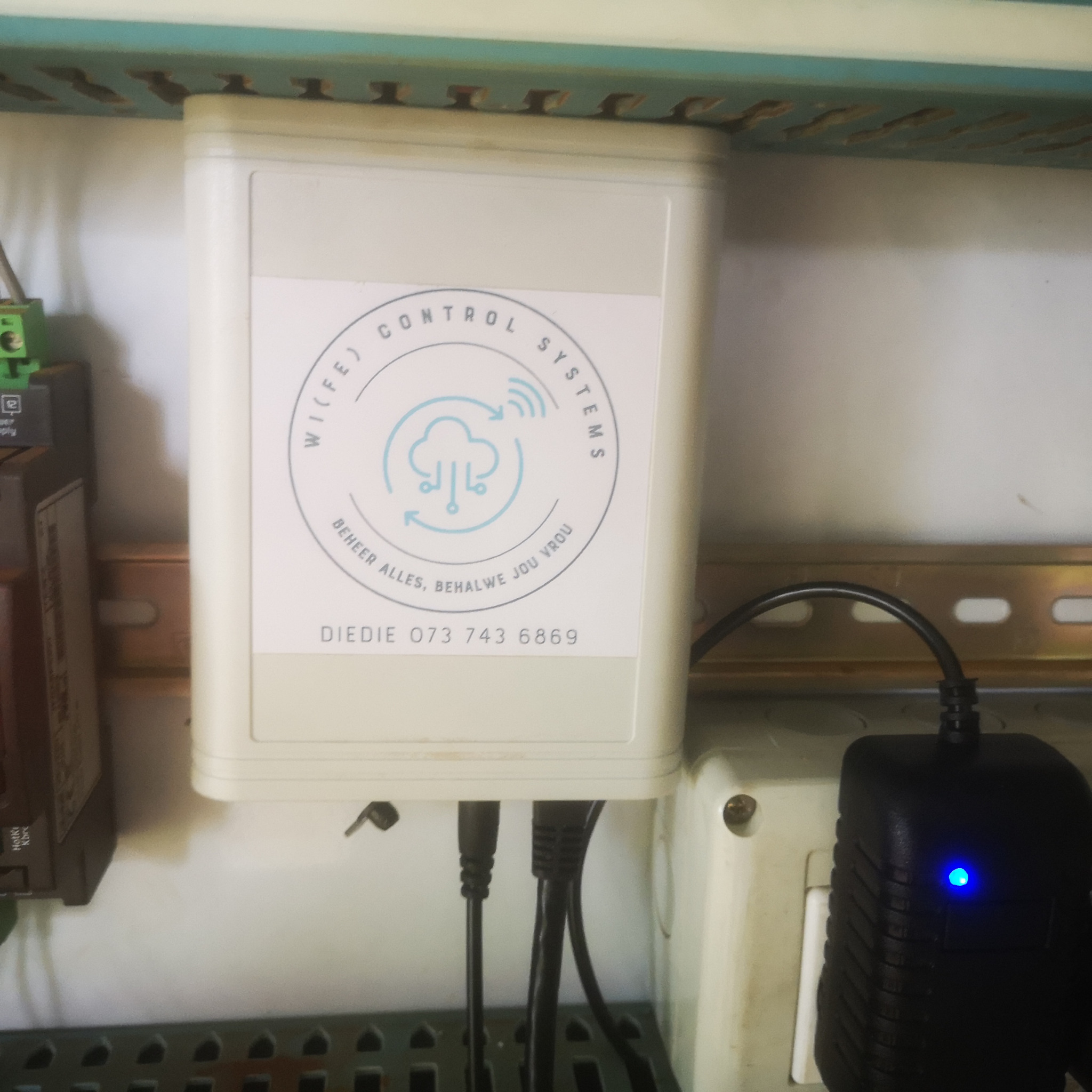 Close-up of WiFe Control Systems interface unit inside coldroom control panel